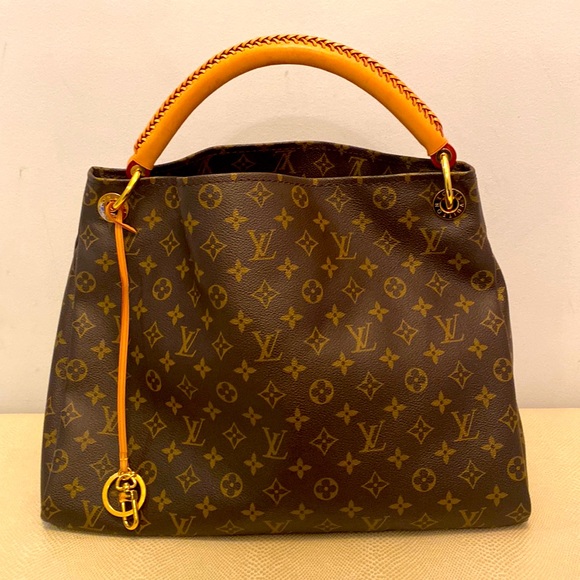 Louis Vuitton Handbags - Louis Vuitton purse. Large. Never used, great condition. Leather. Brown colour.